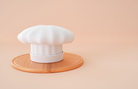 Chefs hat with round cutting board on bright backgroundの写真素材