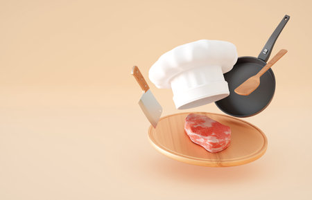 Chefs hat with round cutting board, knife and meat on blue backgroundの写真素材