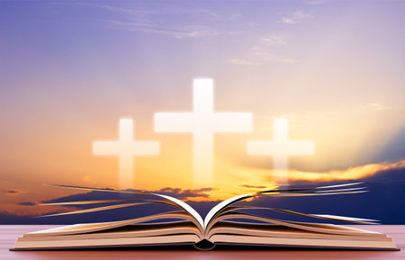 Open book with cross against the sunset. Religious concept. 3d-renderingの写真素材
