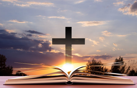 Open book with cross against the sunset. Religious concept. 3d-renderingの写真素材