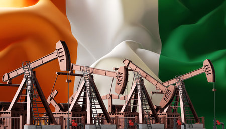 Oil pumpjack on background of Ivory Coast flag. Industrial concept. 3d-renderingの写真素材