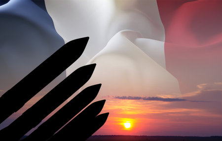 Silhouette of missiles against the sunset with flag of Franceの写真素材