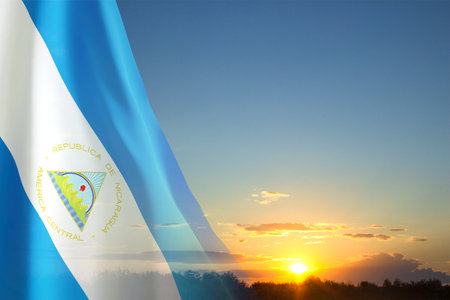 Flag of Nicaragua against the sunsetの写真素材