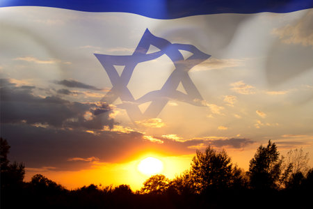 Israel flag with a star of David against the sunset. Banner with place for textの写真素材