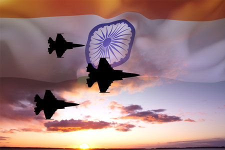 Silhouette of military aircraft against the sunset with India flagの写真素材