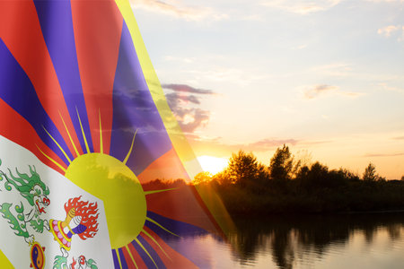 Flag of Tibet against the sunset. National Holidays conceptの写真素材
