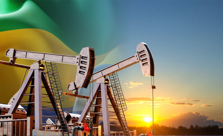 Oil pumpjacks against the sunset with Gabon flag. Oil industry conceptの写真素材