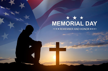 Silhouette of man kneeling down with USA flag against the sunset. Greeting card for Veterans Day, Memorial Day, Independence Dayの写真素材