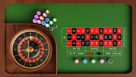 Casino roulette wheel with ball and stack of poker chipsの写真素材
