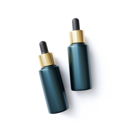 Cosmetic dropper bottle with gold cap on white background. Mockup for skincare branding adsの写真素材