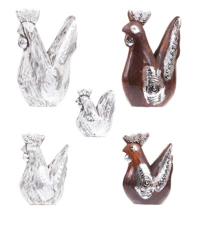 Set of brown and silver wooden chickens, white backgroundの写真素材