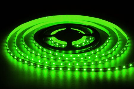 Green LED strip on reel with black backgroundの写真素材