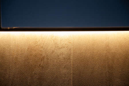 Cement wall texture with warm light.
