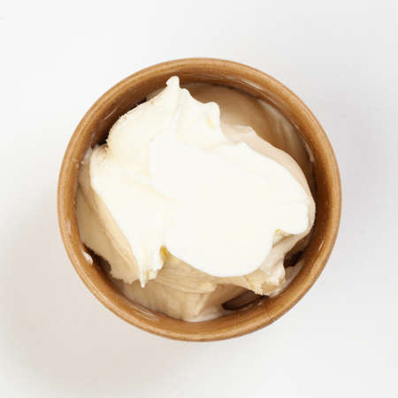 Brown bowl of ice cream top view isolated on white background.の写真素材