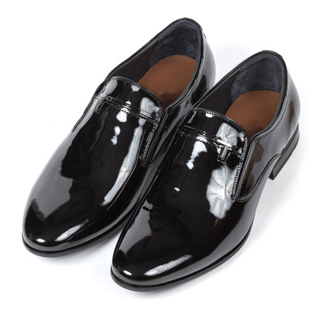 Black leather classic glossy shiny men's shoes without laces with a brown insole with low heels on a white background.の写真素材