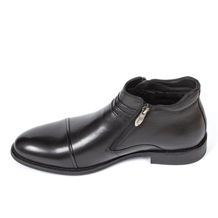 Black leather classic men's autumn insulated ankle boots with fur inside on a thin heel on a white background.の写真素材