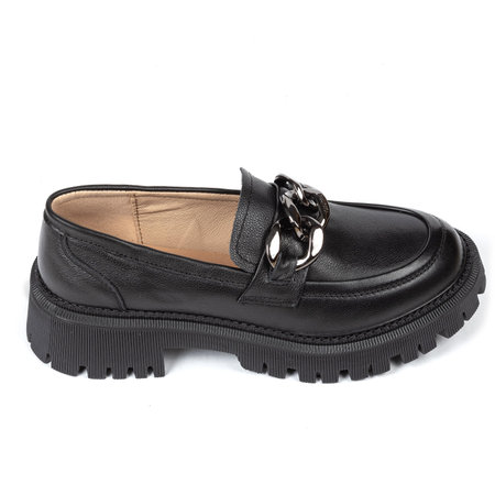 Black women's leather ankle boots on a thick rubber sole decorated with a metal chain on a white background.の写真素材