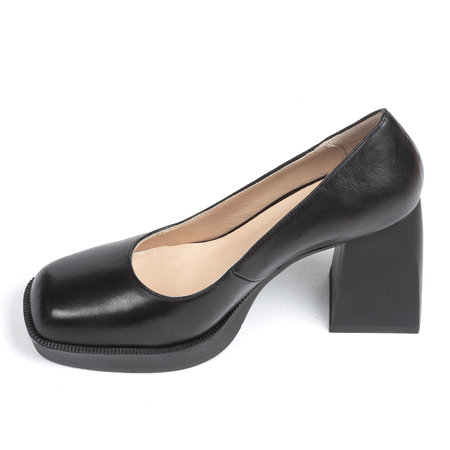 Black suede comfortable leather classic evening women's shoes with a strap on a thick square heel on a white background.の写真素材