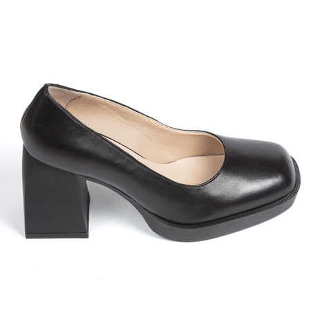 Black suede comfortable leather classic evening women's shoes with a strap on a thick square heel on a white background.の写真素材