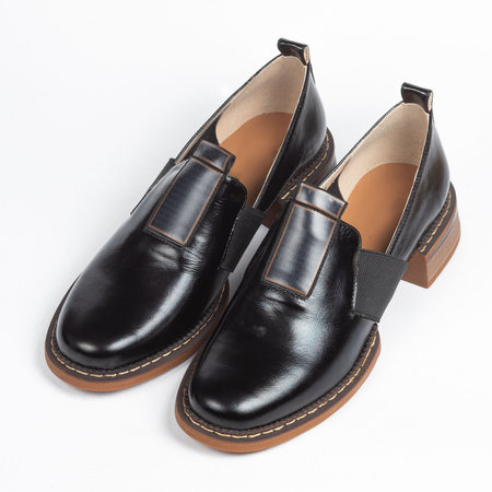 Black women leather office ankle boots with low heels on a white background.の写真素材