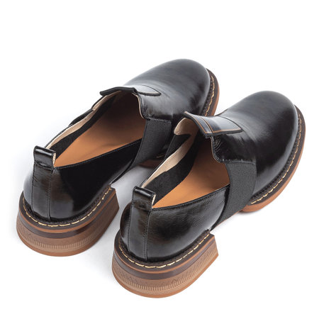 Black women leather office ankle boots with low heels on a white background.の写真素材