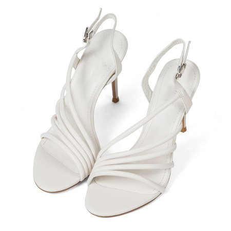 Fashionable White Leather Women's Sandals Shoes with Thin High Heels with Straps on White Background.の写真素材