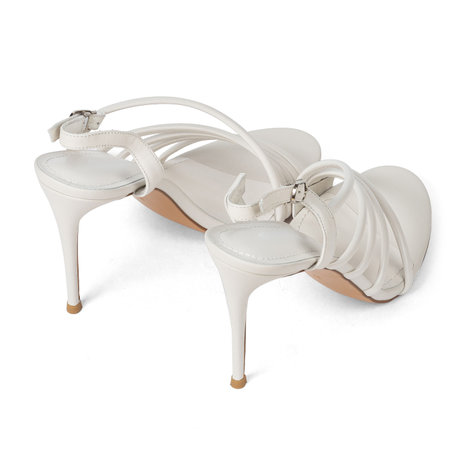 Fashionable White Leather Women's Sandals Shoes with Thin High Heels with Straps on White Background.の写真素材