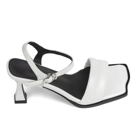 White Leather Women's Fashionable Sandals Shoes with Black Insole on High Heels on White Background.の写真素材