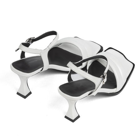 White Leather Women's Fashionable Sandals Shoes with Black Insole on High Heels on White Background.の写真素材