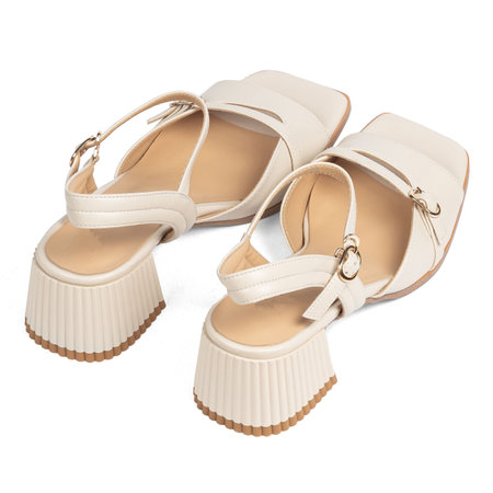 White Women's Leather Shoes Sandals with Low Thick Heels on White Background.の写真素材