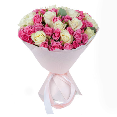 Light pink wedding flower bouquet wrapped in paper cone with ribbon isolated on white background.の写真素材