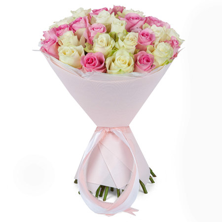 Light pink wedding flower bouquet wrapped in paper cone with ribbon isolated on white background.の写真素材