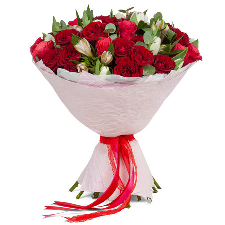 Red flowers bouquet wrapet in pink paper with red ribbon over white background.の写真素材