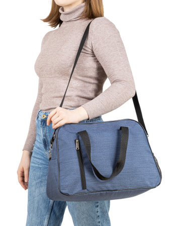 Young woman with sport bag in hand isolated white background.の写真素材