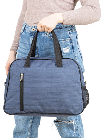 Young woman with sport bag in hand isolated white background.の写真素材