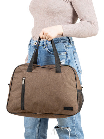 Young woman with sport bag in hand isolated white background.の写真素材