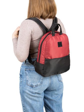 Woman in casual clothing with backpack bag isolated on white background.の写真素材