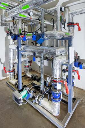 Modern industial pumping station with heal exchangers and valves.の写真素材