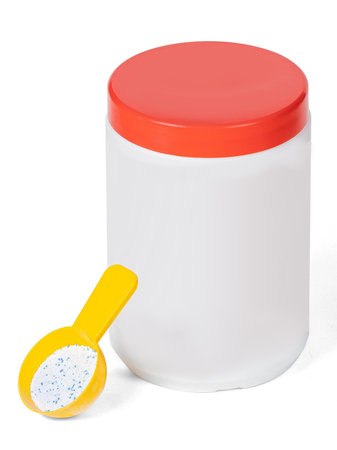 White plastic container with washing powder with yellow spoon isolated on white backgroundの写真素材