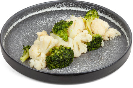 Boiled broccoli and cauliflower on a plate.の写真素材