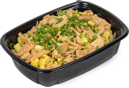 A black container filled with tasty food on a white backgroundの写真素材