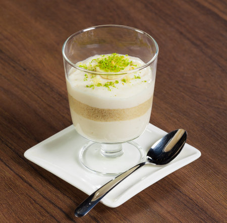 Panna cotta dessert in glass on brown table.の写真素材