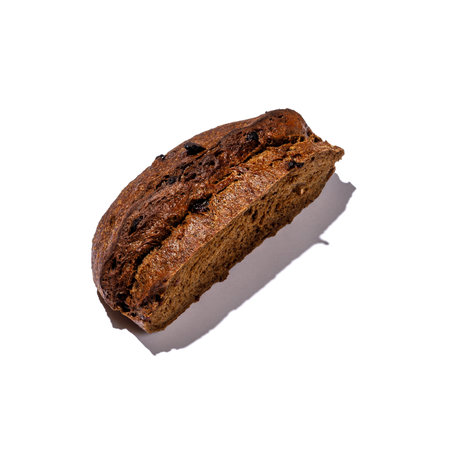 This is a closeup image showcasing a delectable piece of food placed against a stark white background, highlighting its details beautifullyの写真素材