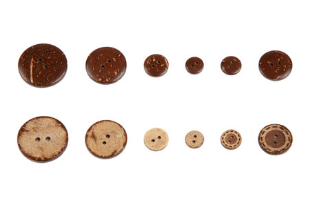 Set of coconut wood natural buttons isolated on white backgroundの写真素材