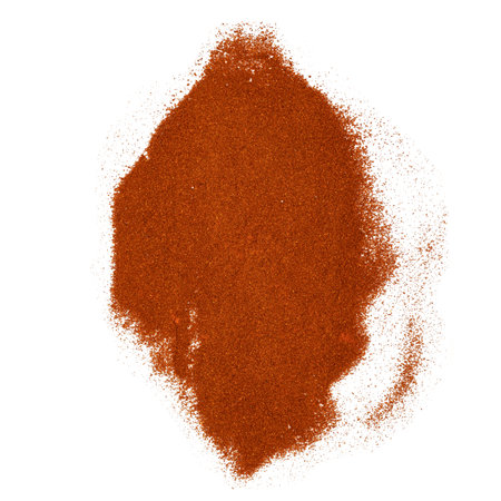 A heap of vibrant red chili powder, showcasing its rich texture and color on a clean white background, perfect for culinary and spice-related visuals.の写真素材
