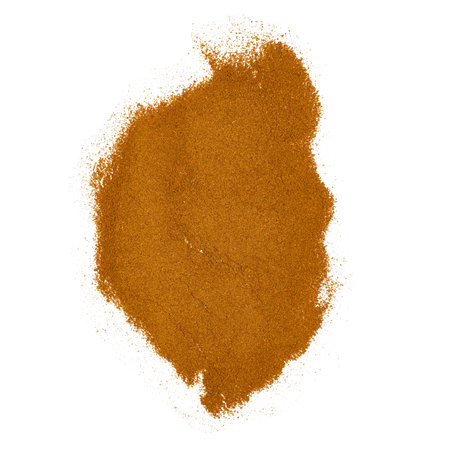 A vibrant pile of fine ground spice powder featuring a rich orange hue, perfect for culinary uses.の写真素材