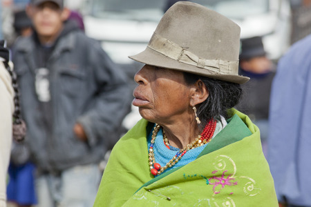 Indian woman identified or not wearing green hat and a ponchoのeditorial素材