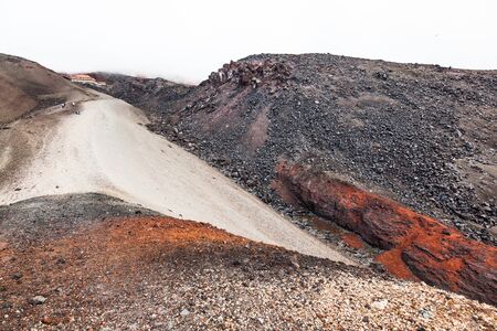 Way up to the refuge of Cotopaxi, sand and rock slopes.