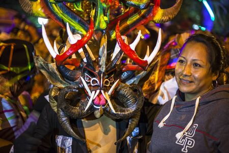 PÃ­llaro, ECUADOR - FEBRUARY 6, 2016: Unknown locals dressed up participating in the Diablada, popular town celebrations with people dressed as devils dancing in the streetsのeditorial素材