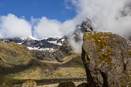 EL ALTAR, ECUADOR - MARCH 08:  Hiker unidentified walking around the crater of El Altar volcano, taking a break on march 08 2015, El Altar, Ecuadorのeditorial素材